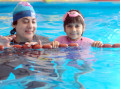 fbc-swimming-kids-with-lady-instructor