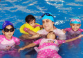 fbc-swimming-kids-with-lady-trainer